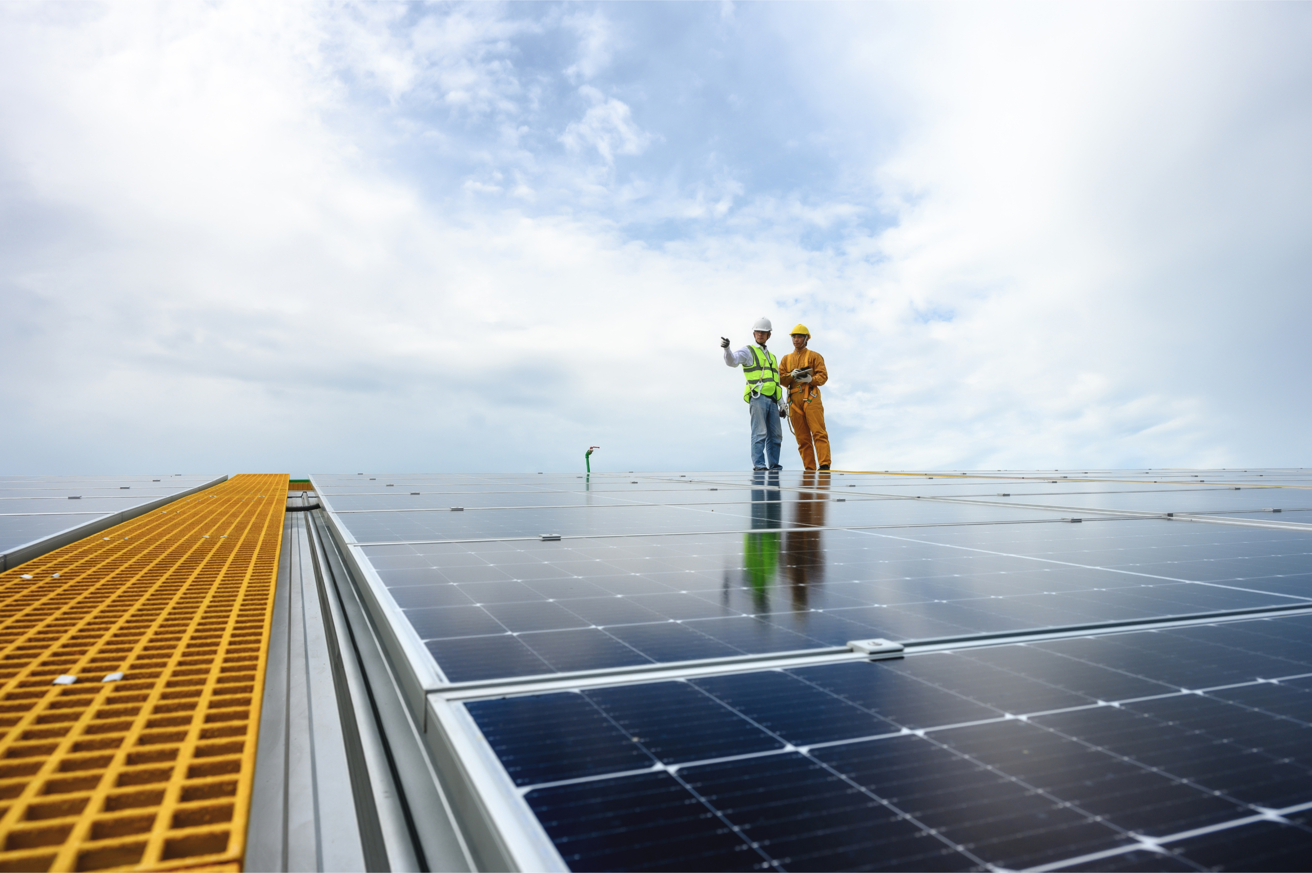 EHS two workers on solar panels